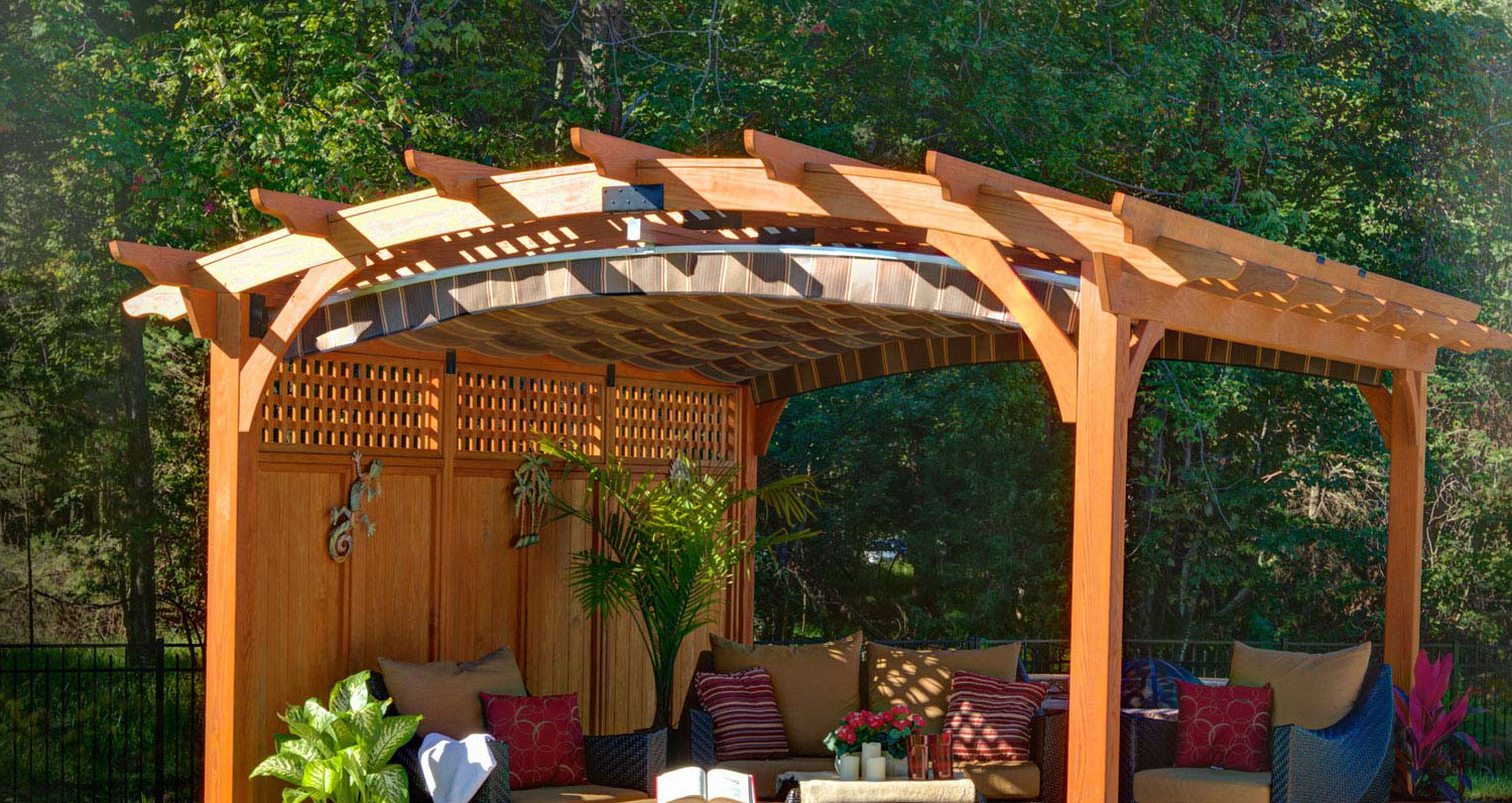 wooden arched pergola with privacy wall and EZShade