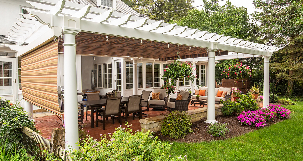 arched wooden pergola with privacy wall and EZShade